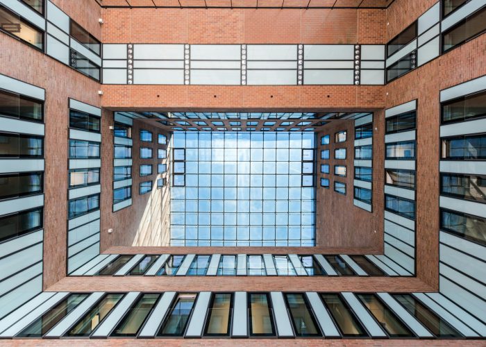 Intricate view of a modern atrium ceiling in Hamburg showcasing futuristic architecture and design.